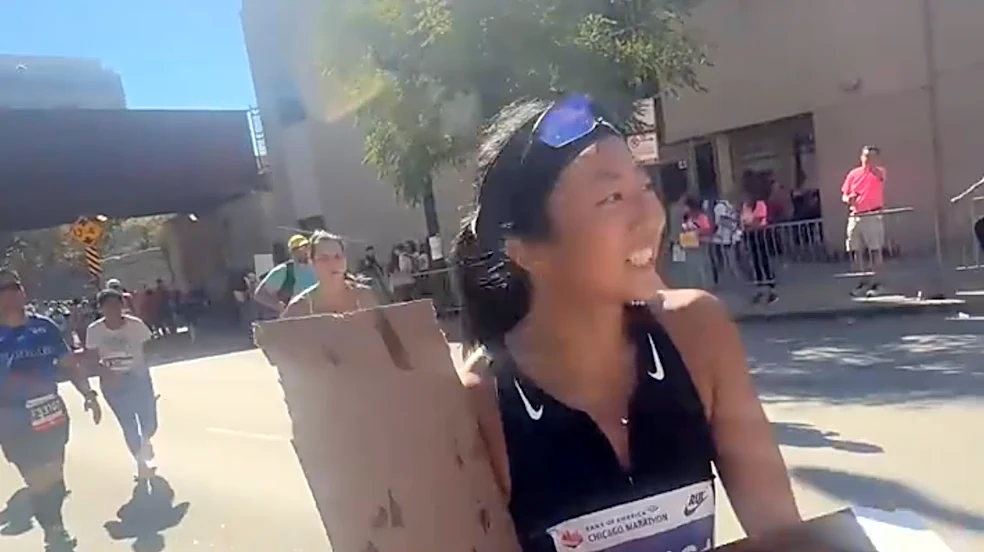 This marathoner does shots and eats pizza. Yes. During the race