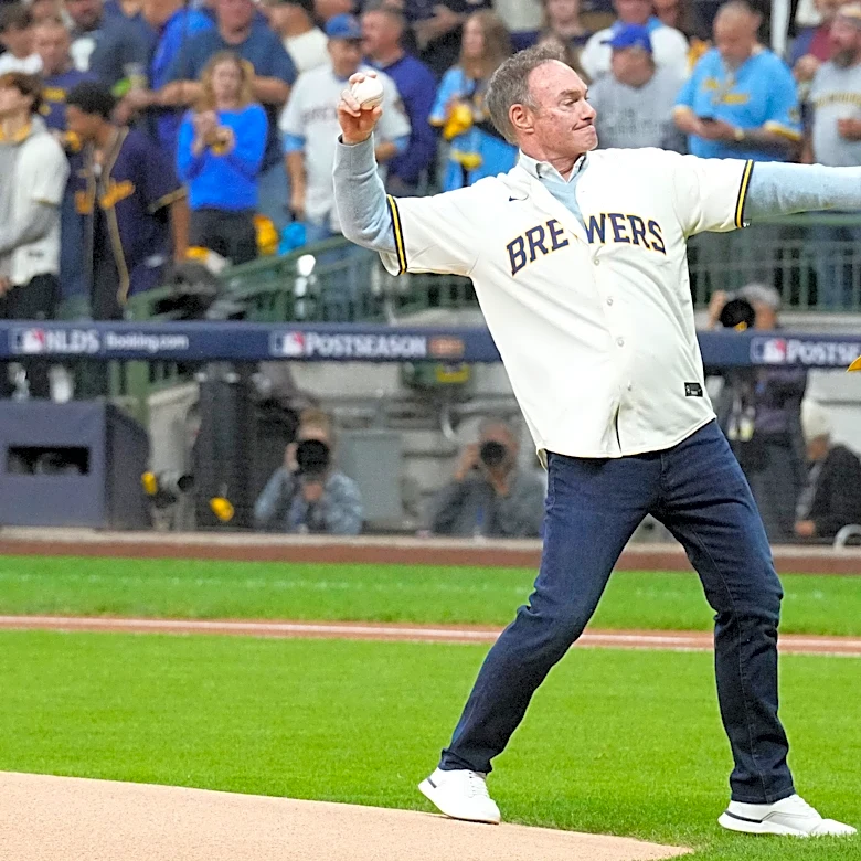 Who is singing World Series Game 2 anthem and throwing first pitch in Milwaukee?