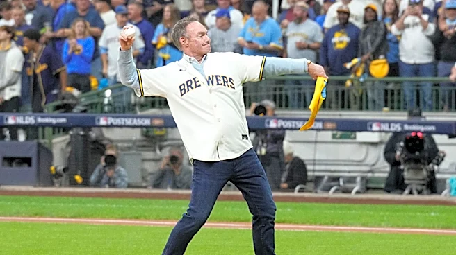 Who is singing World Series Game 2 anthem and throwing first pitch in Milwaukee?