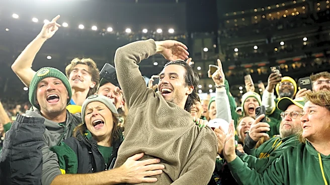 Brewers bring World Series trophy to Packers game, Sal Frelick does Lambeau Leap
