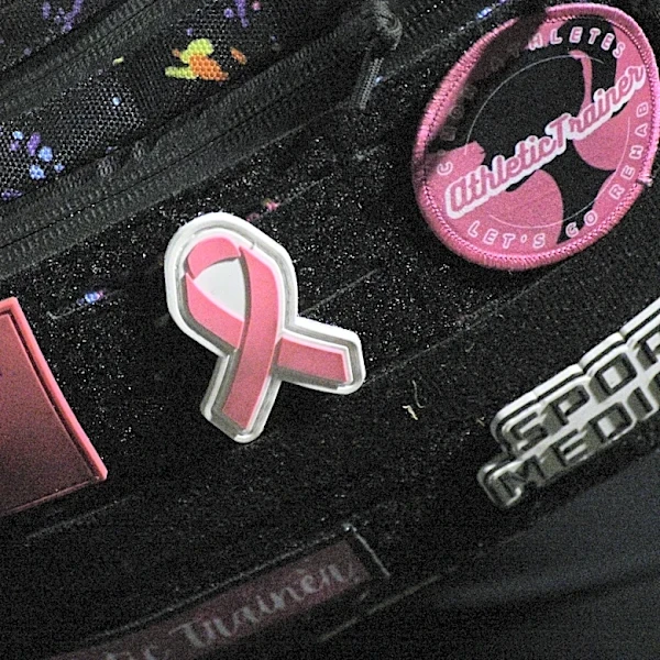 Texas football team surprises mom battling breast cancer with emotional tribute