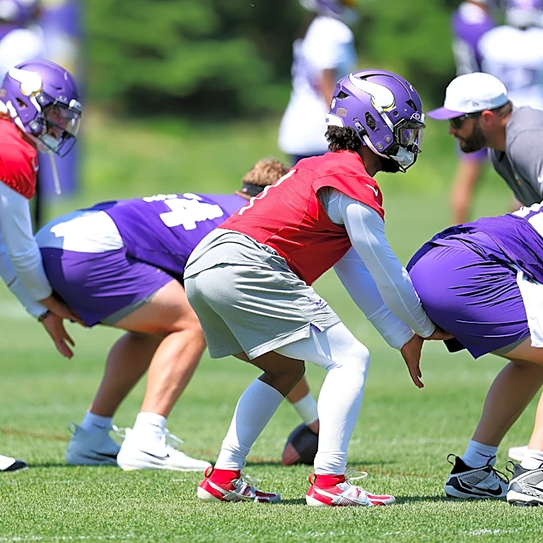 Which position battle does ESPN have its eyes on with the Vikings?