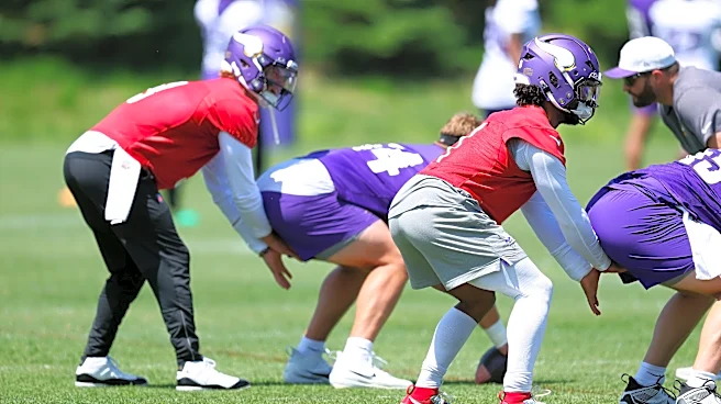 Which position battle does ESPN have its eyes on with the Vikings?