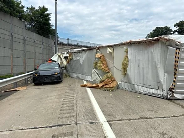 Tractor-trailer overturns after striking Thruway overpass in South Nyack