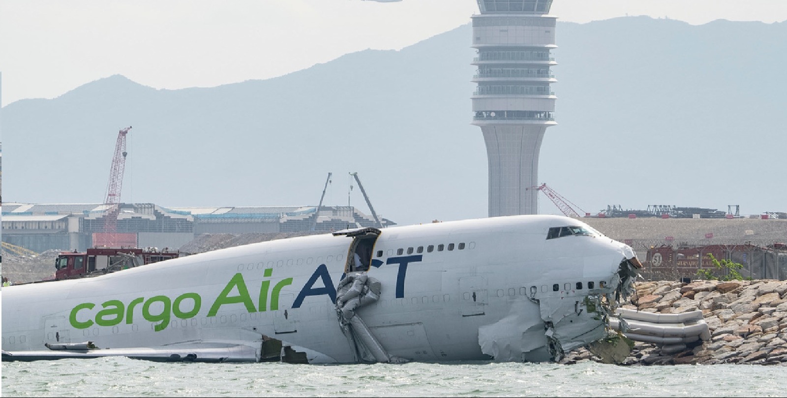 VIDEO | Cargo aircraft skids off Hong Kong runway, collides with security patrol car, killing 2, AP explains