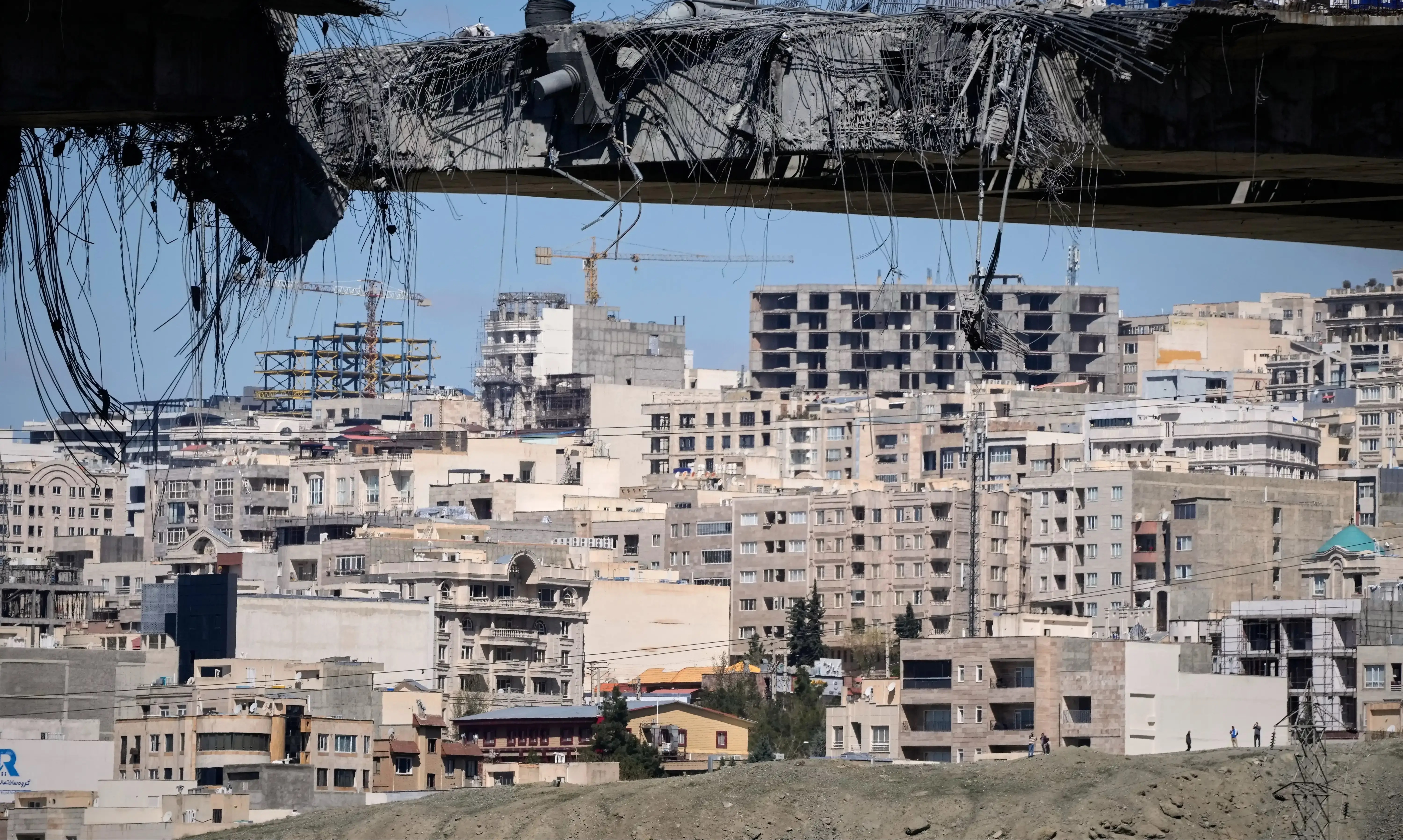 The Latest: Iran launches missiles at Israel and Gulf states as explosions hit Tehran