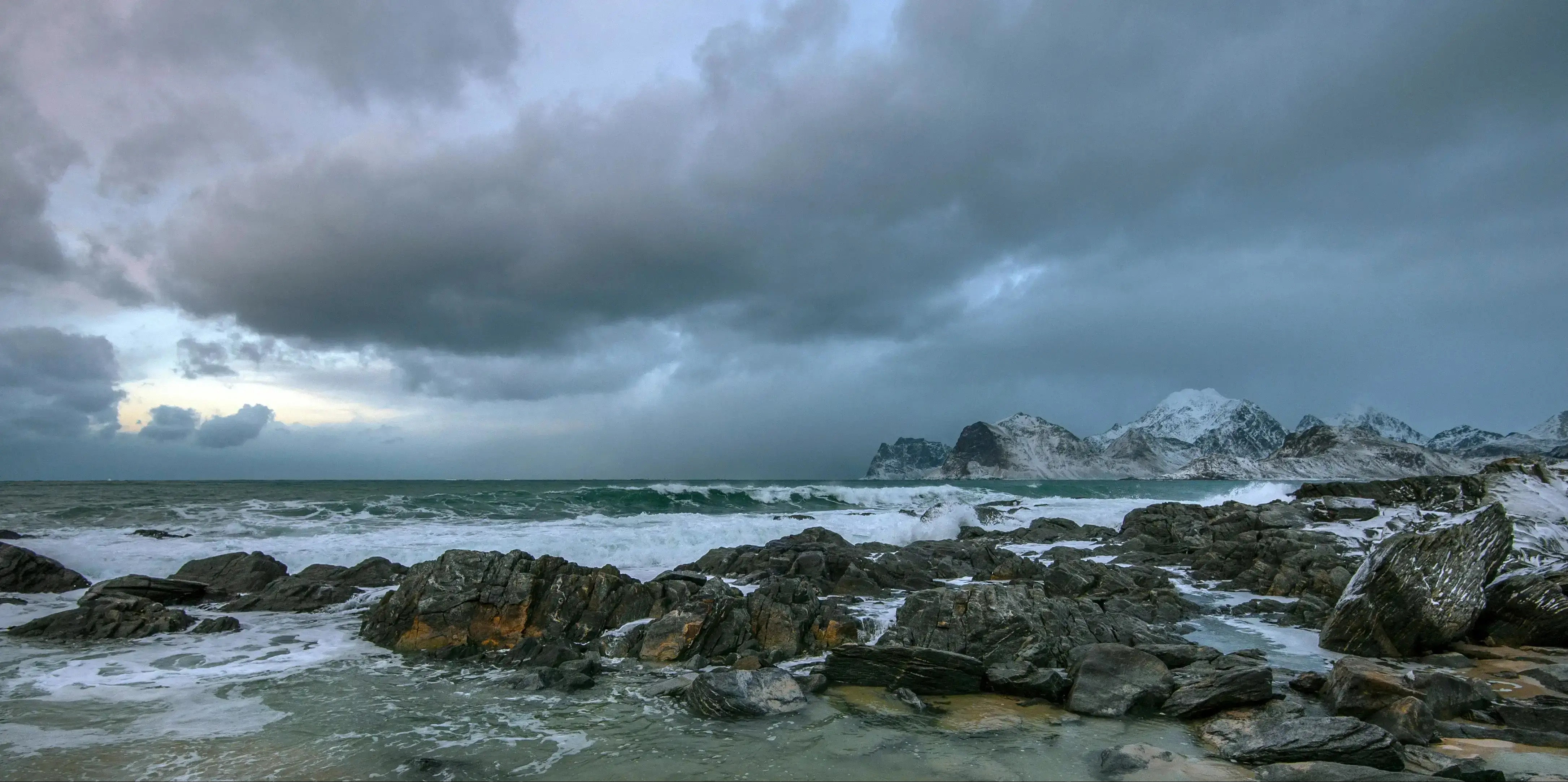 Light Rain and Mountain Snow Linger Over Northwest and Northern Rockies